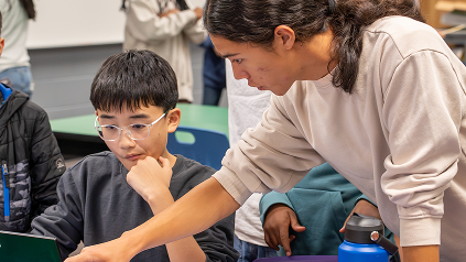 Students volunteering at a STEM activity